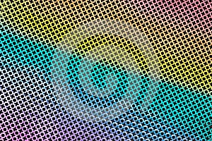Texture of perforated metal sheet stamped or punched to create a XO pattern in rainbow color