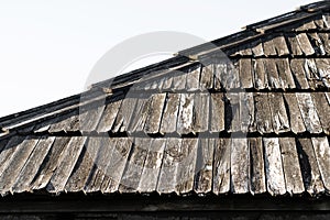 Texture photo of an old wooden house roof. Rustic wood tile.