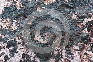 Texture of pink black stone .