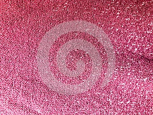 Texture of pink purple synthetic fabric for clothing. The background