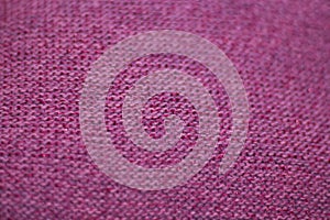 Texture of pink wool knitted fabric as background