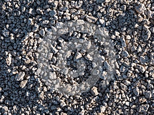 Texture of a placer of small rock stones photo