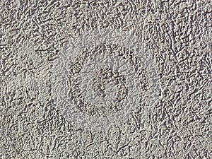 The texture of the plaster is bark beetle on the wall. Seamless texture