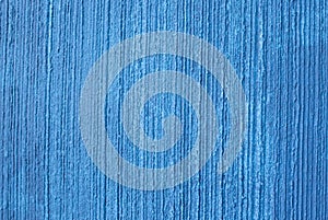 Texture of a plastered wall painted in blue. Concept background.