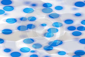 Texture of a plastic surface with blue circles, reflections from lighting