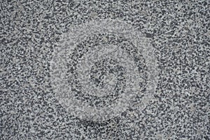 Texture of polished grey granite from above