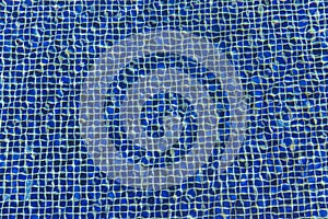The texture of the pool ceramics through the water
