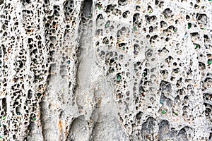 texture of porous stones on the beach, nature, natural phenomena, brown gray stones