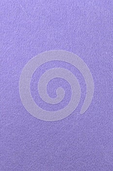 The texture of a purple fabric made of soft felt. Purple background for text. Clean background. Vertical photo