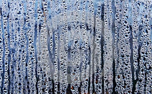 Texture of rain drops on a glass wet transparent surface