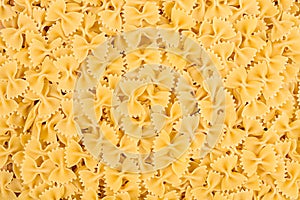 Texture of raw farfalle noodles pasta italian food macro background