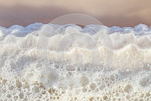 Texture of raw salt on sea water in evaporation ponds process at