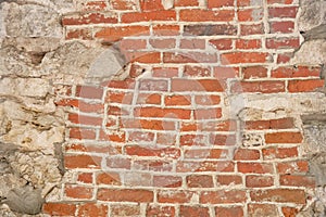 Texture of red brick wall with boulders, retro brickwork background, copy space