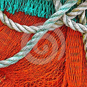 Texture Of A Red Green Fishing Net With A Robe