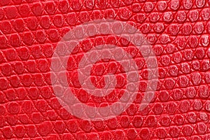 Texture of red leatherette closeup. photo
