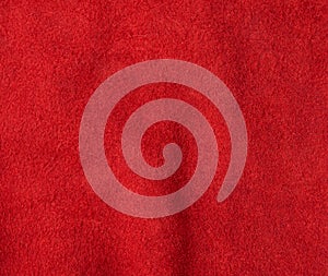 Texture of red suede with large fibers, bright scarlet color