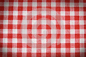 Texture of a red and white checkered picnic blanket.