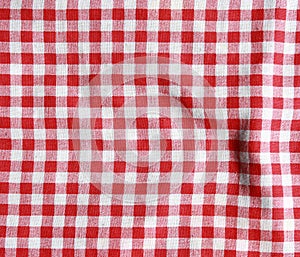 Texture of a red and white checkered picnic blanket.