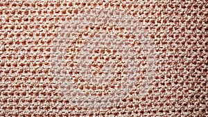 Texture of red wicker fabric background. fabric background with metal weave. Rough woven red material with shiny inserts. Texture