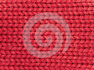 Texture of red woolen knitted fabric