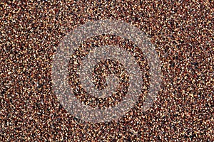 Texture of red, yellow and black coarse sand grains