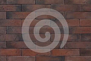 Texture of reddish-brown rectangular bricks wall,