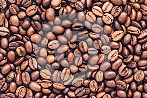 Texture of roasted coffee beans. Coffee grains background. Top view, flat lay, copy space