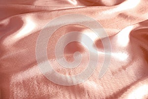 Texture of rose gold silk