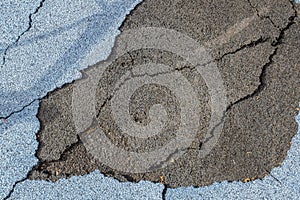 Texture of rubberized coating with cracks appeared on the old Playground in the infected and abandoned area