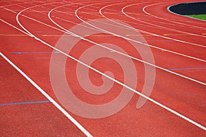 Texture of run red track way in sport competition stadium backg