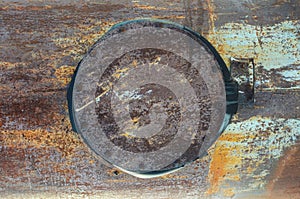 Texture, rusty metal, pipe with a closed hatch