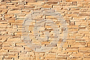 Texture of a sand-colored brick wall