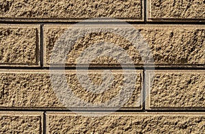Texture of sand-colored bricks background close up