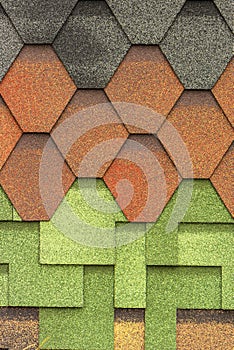 The texture of the shingles is close-up. Roofing material