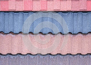The texture of the shingles is close-up. Roofing material