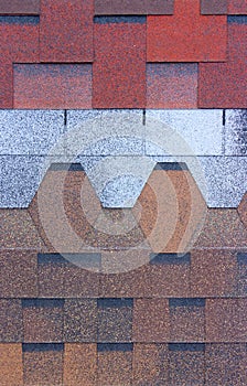 The texture of the shingles is close-up. Roofing material