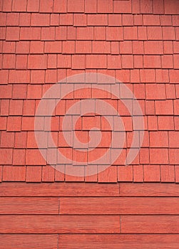 The texture of the shingles is close-up. Roofing material