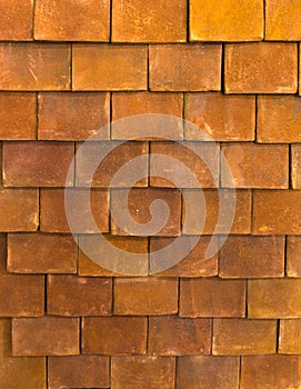 The texture of the shingles is close-up. Roofing material