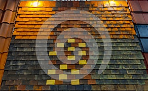 The texture of the shingles is close-up. Roofing material