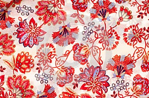 The texture of the silk fabric, red flowers on a white background