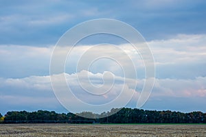 Texture of the sky clouds and rays of sun on a background