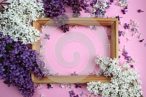 Texture of small flowers of lilac of different shades of purple around the frame