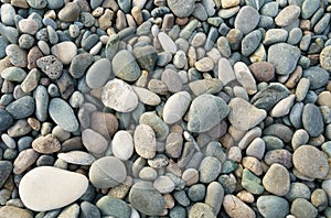 Texture of small sea pebbles. View from above.