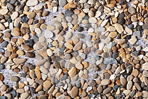 Texture of small stones for design on a summer theme