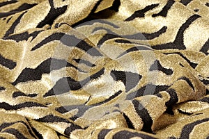 Texture of snake leather skin. Synthetic fabric texture, background. Yellow-black fabric