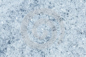 The texture of the snow surface closeup