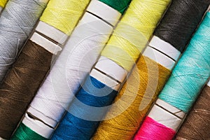 Texture from spools with multi-colored threads, top view