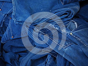 Stack blue jeans background