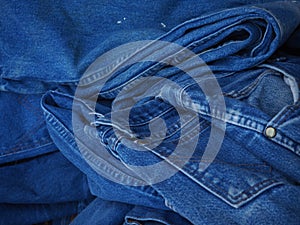 Stack blue jeans background