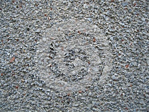 The texture of the stone gray wall of the house